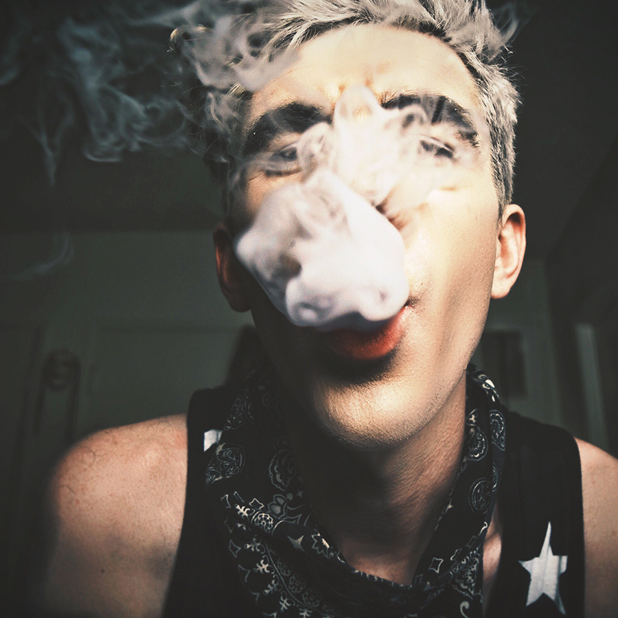 ult customer exhaling vapor using a vape device